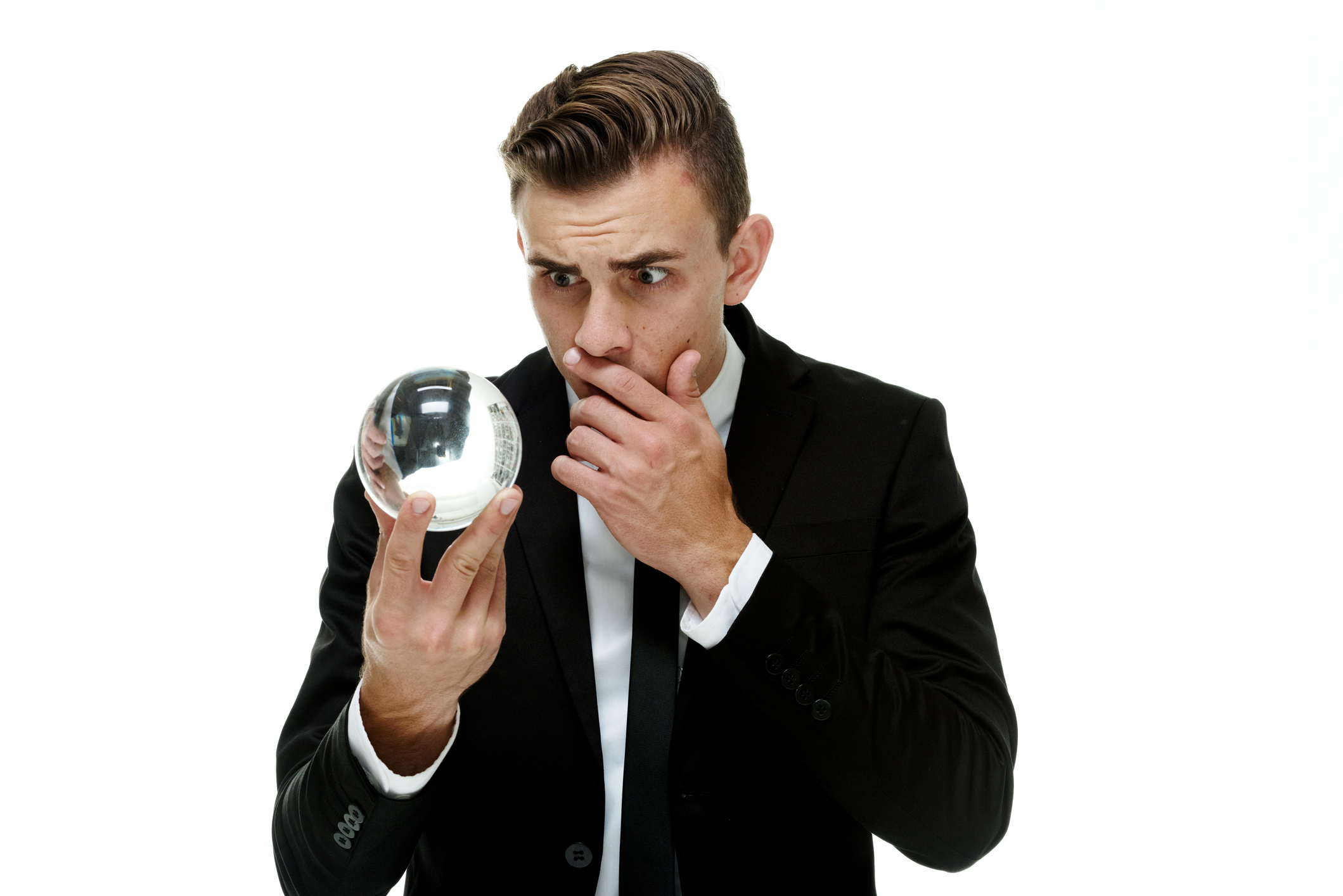 Terrified businessman with crystal ball