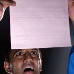 Concerned person looking at paper