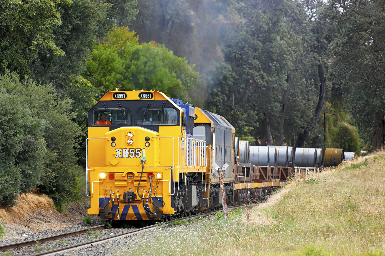 Freight train pulling up hill
